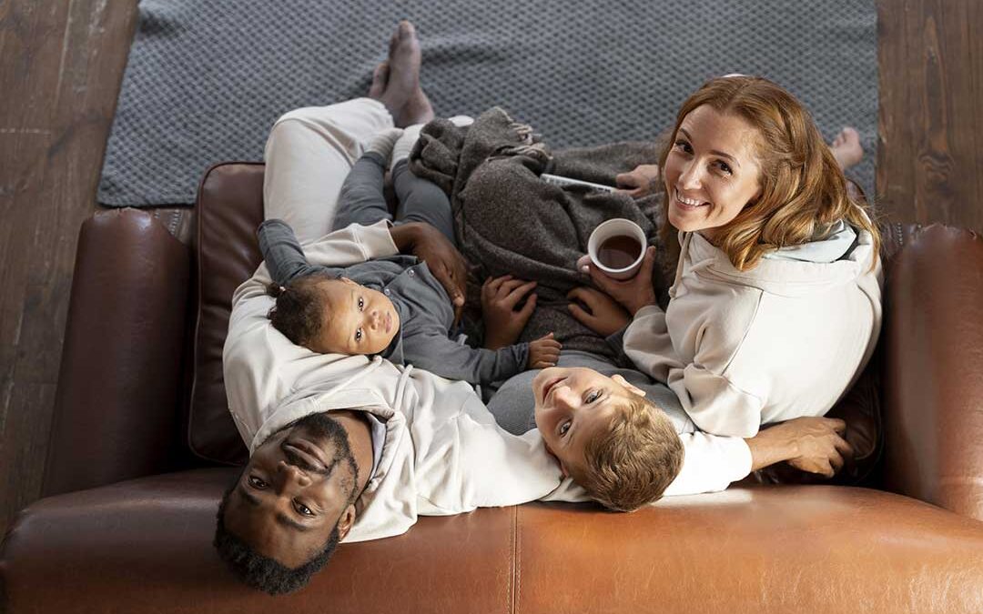Happy family sitting on couch